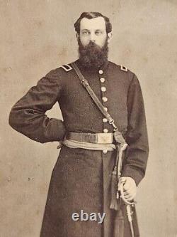 Cdv of unidentified officer with sword and unique strap, Cooperstown NY backmark